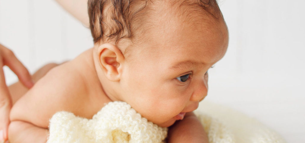 Infant receiving massage