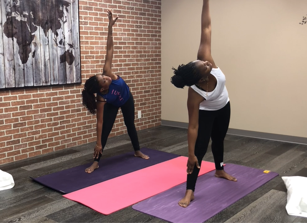 two women doing a private therapeutic yoga session at avoshea therapy and wellness clinic